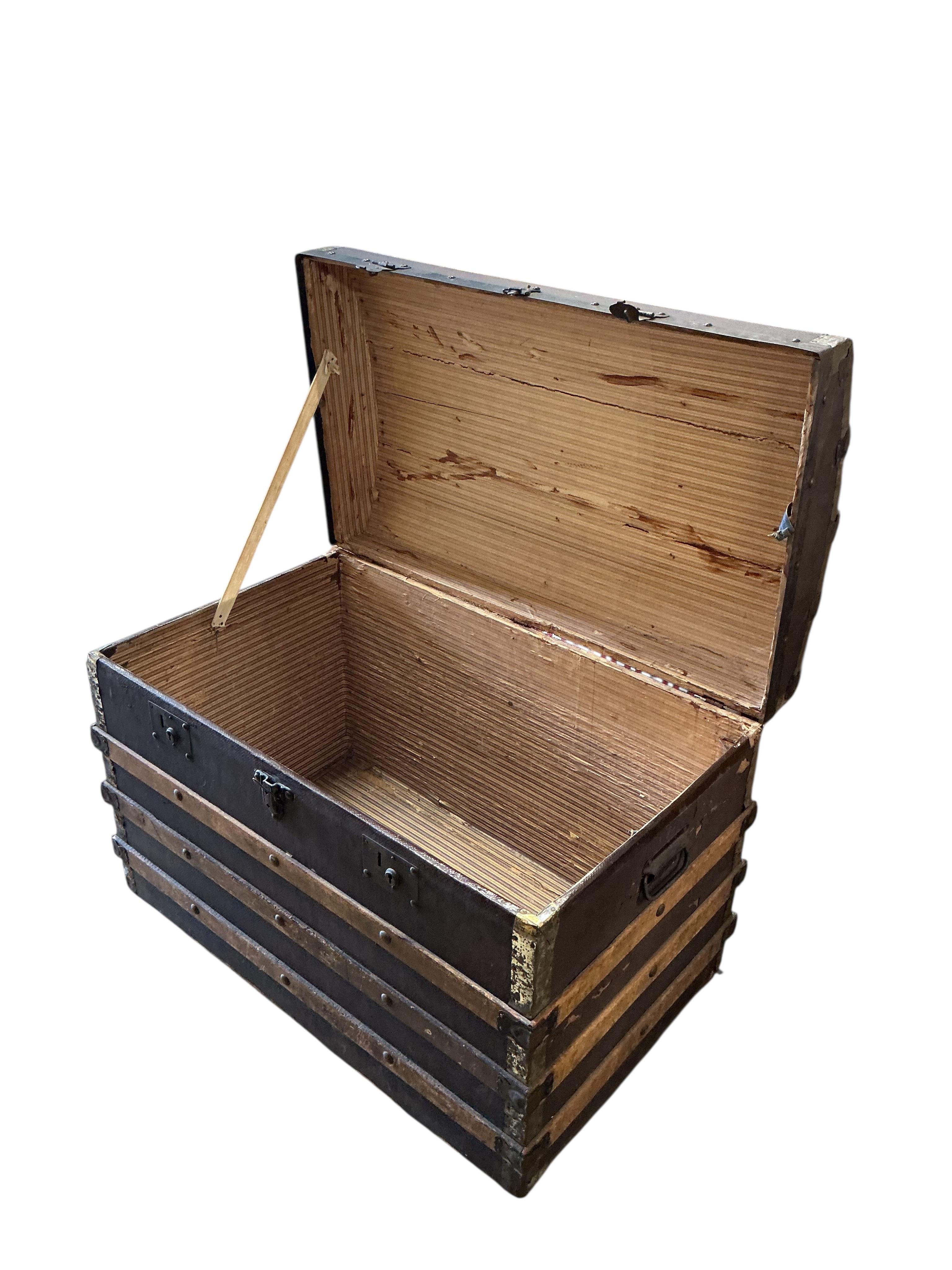 A late Victorian canvas covered dome topped trunk, width 84cm, depth 50cm, height 62cm
